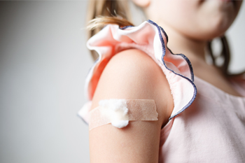 Child with bandaid on arm